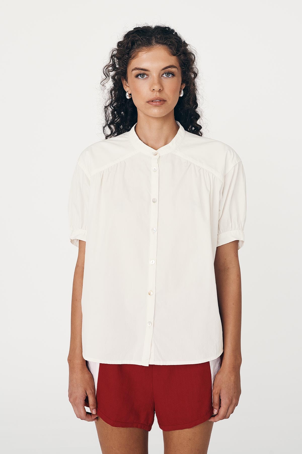 White Cora Spring Blouse worn with Siren Red Linen Shorts by ROWIE The Label