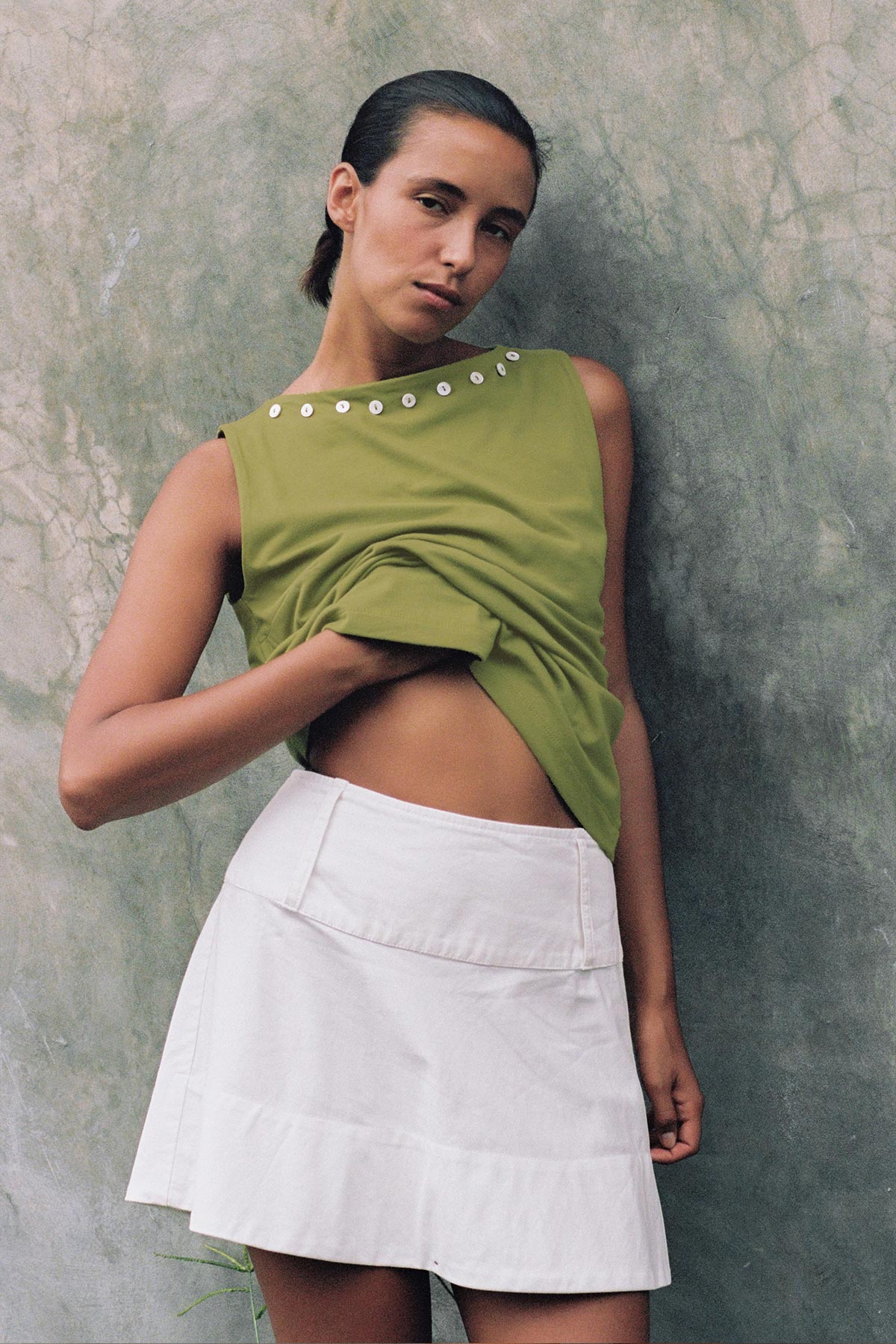 Anouk Mini Skirt in White, with large belt loops and paired with the Muriel Button Boatneck Tank Top in Green