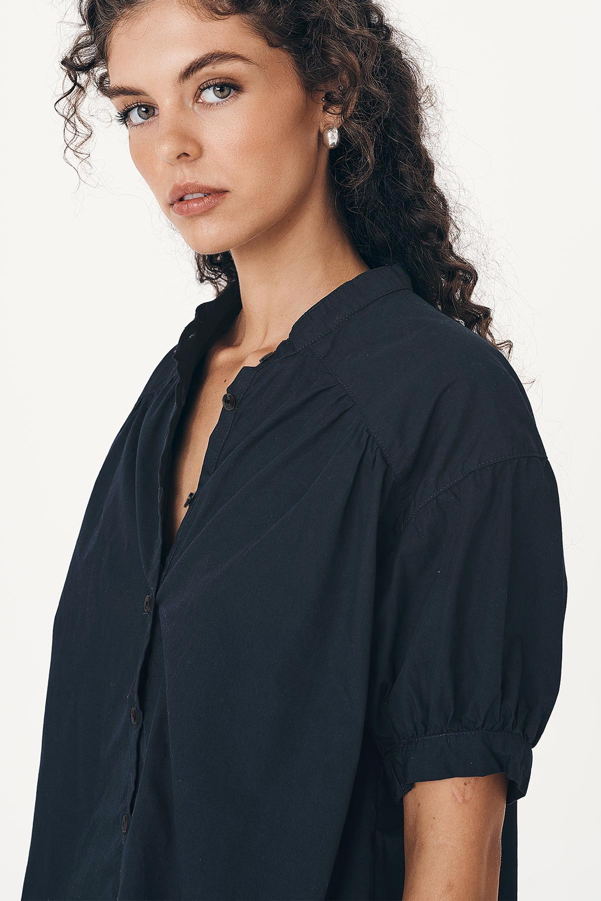 Close-up studio view of model wearing a Cora Spring Blouse in Ink Cotton by ROWIE the Label.