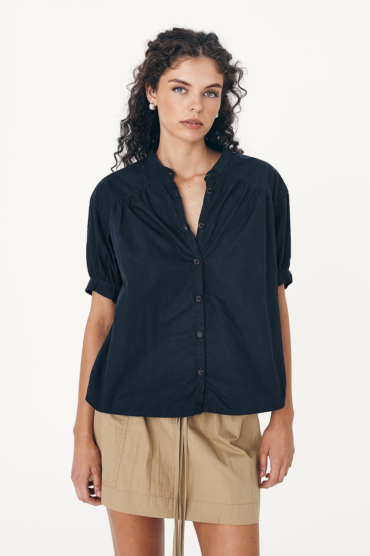 Model wearing a Cora Spring Blouse in Ink Cotton, paired with the Jessica Cargo Mini Skirt in Washed Khaki by ROWIE the Label, front studio view.