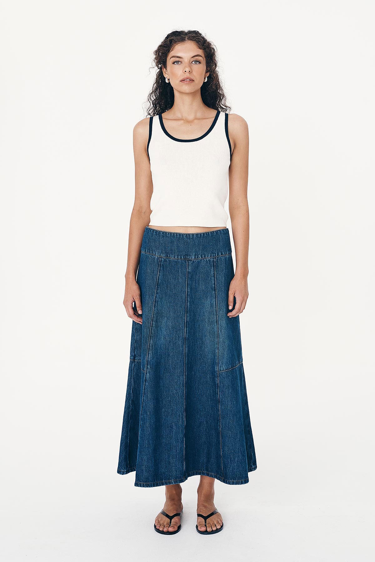 Full-body studio view of model wearing a Blake Contrast Knit Tank top in cream with Ink blue trim, paired with the Vashti Denim Midi Skirt by ROWIE the Label.