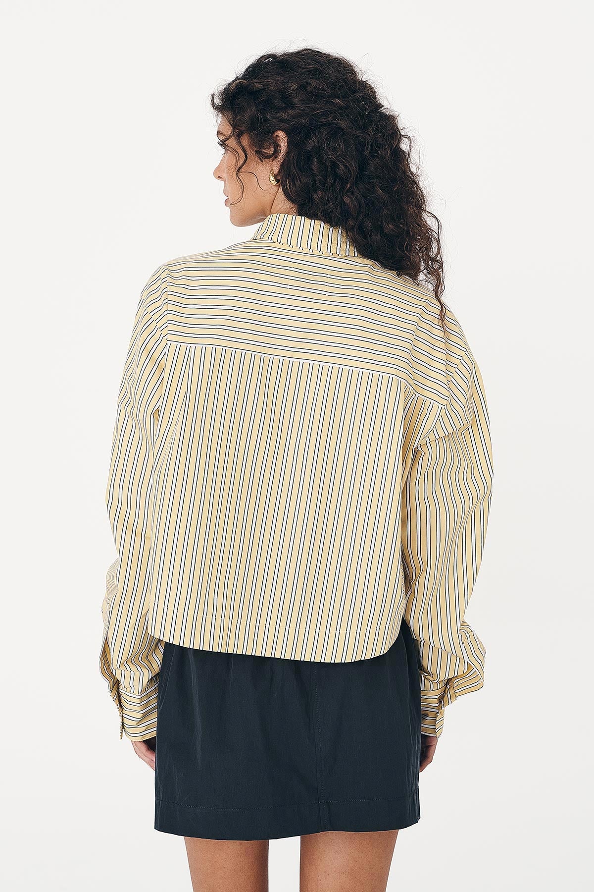 Cole Stripe Crop Shirt with Long Sleeves and paired with a Cargo Mini Skirt in Black - showing back detail.