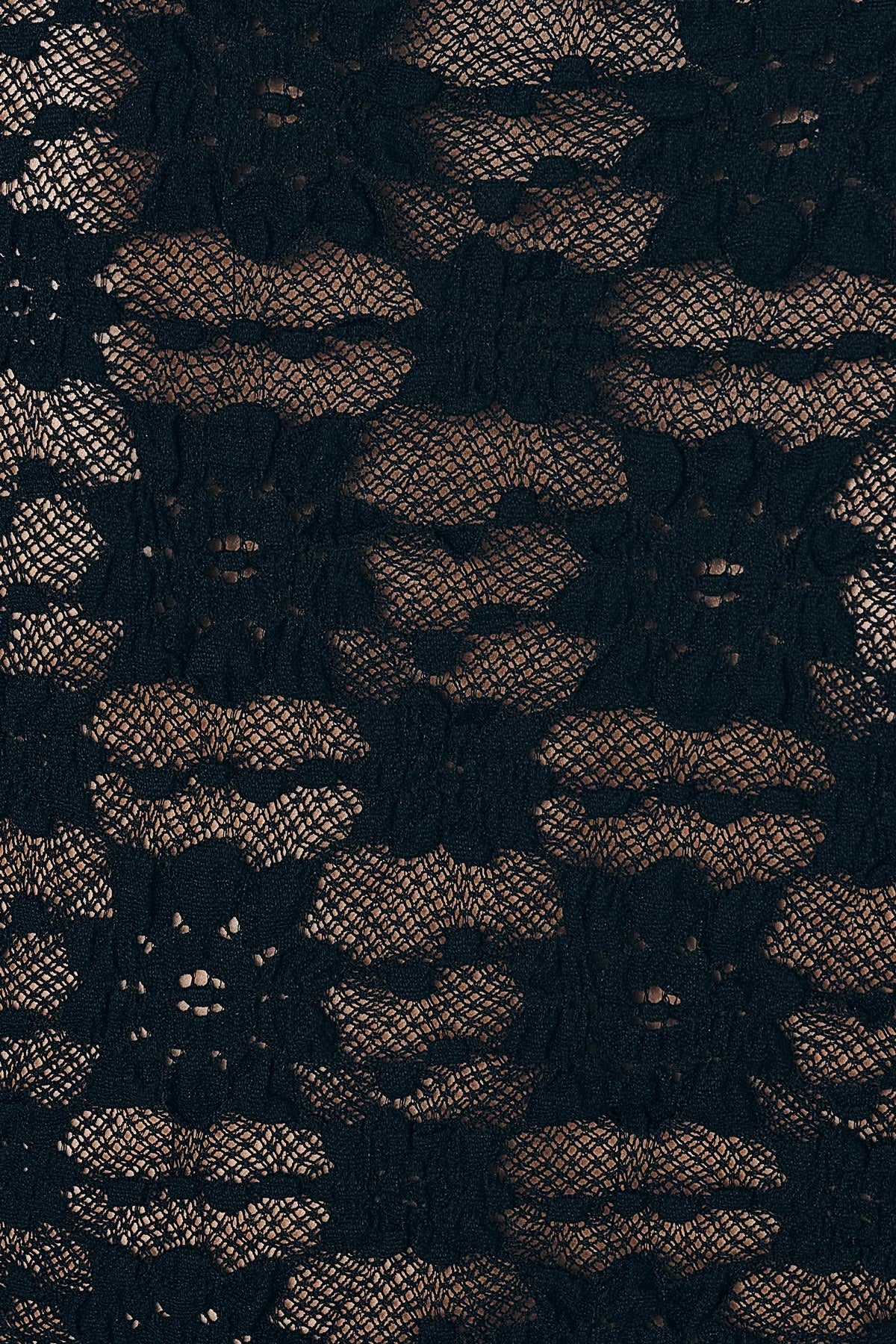 Close up of the woven floral detail from the Galo Sunflower Lace Tee