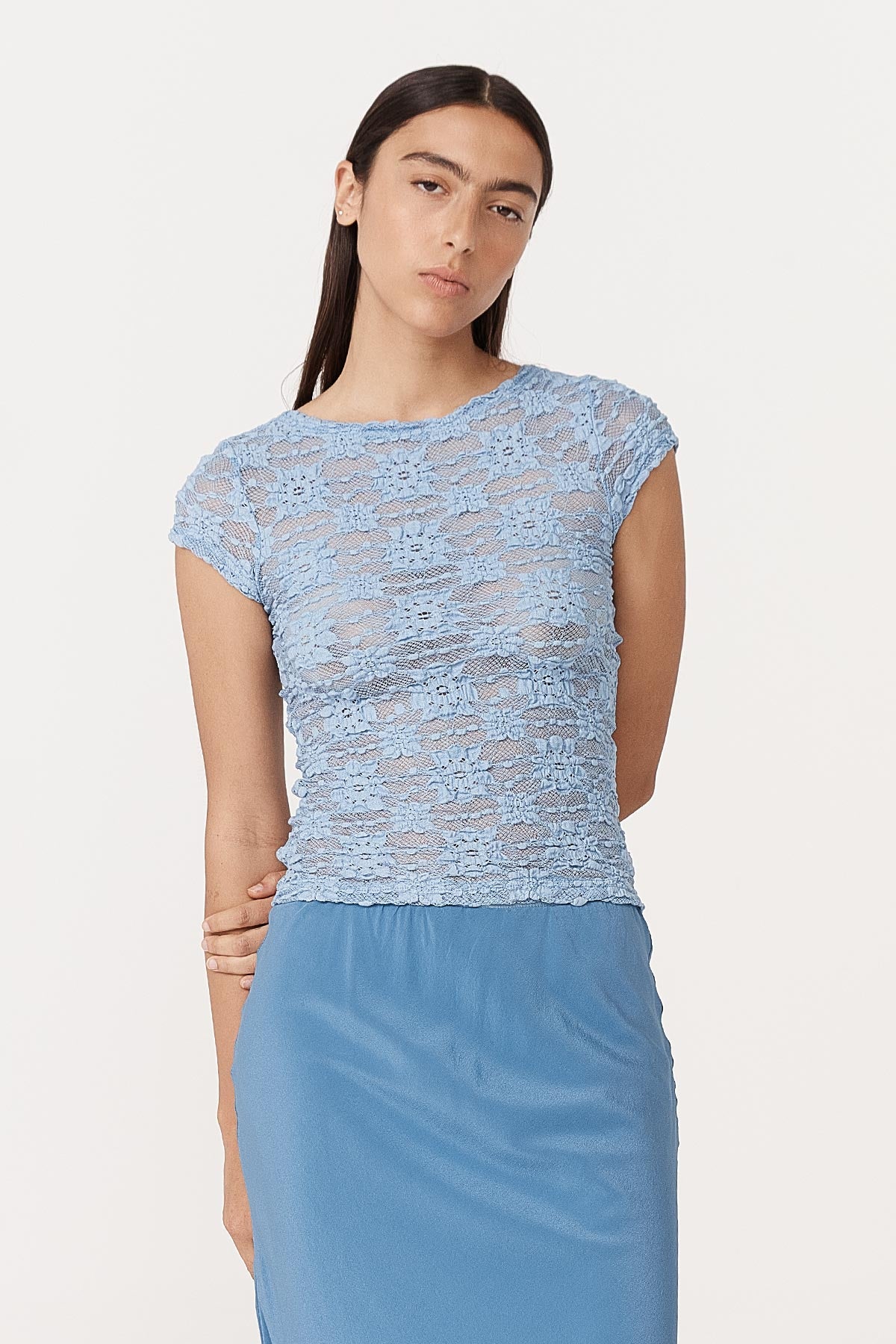 Model wearing a Galo Sunflower Lace Tee in Periwinkle, styled with the Marina Silk Midi Skirt in Cornflower by ROWIE the Label, front studio view.