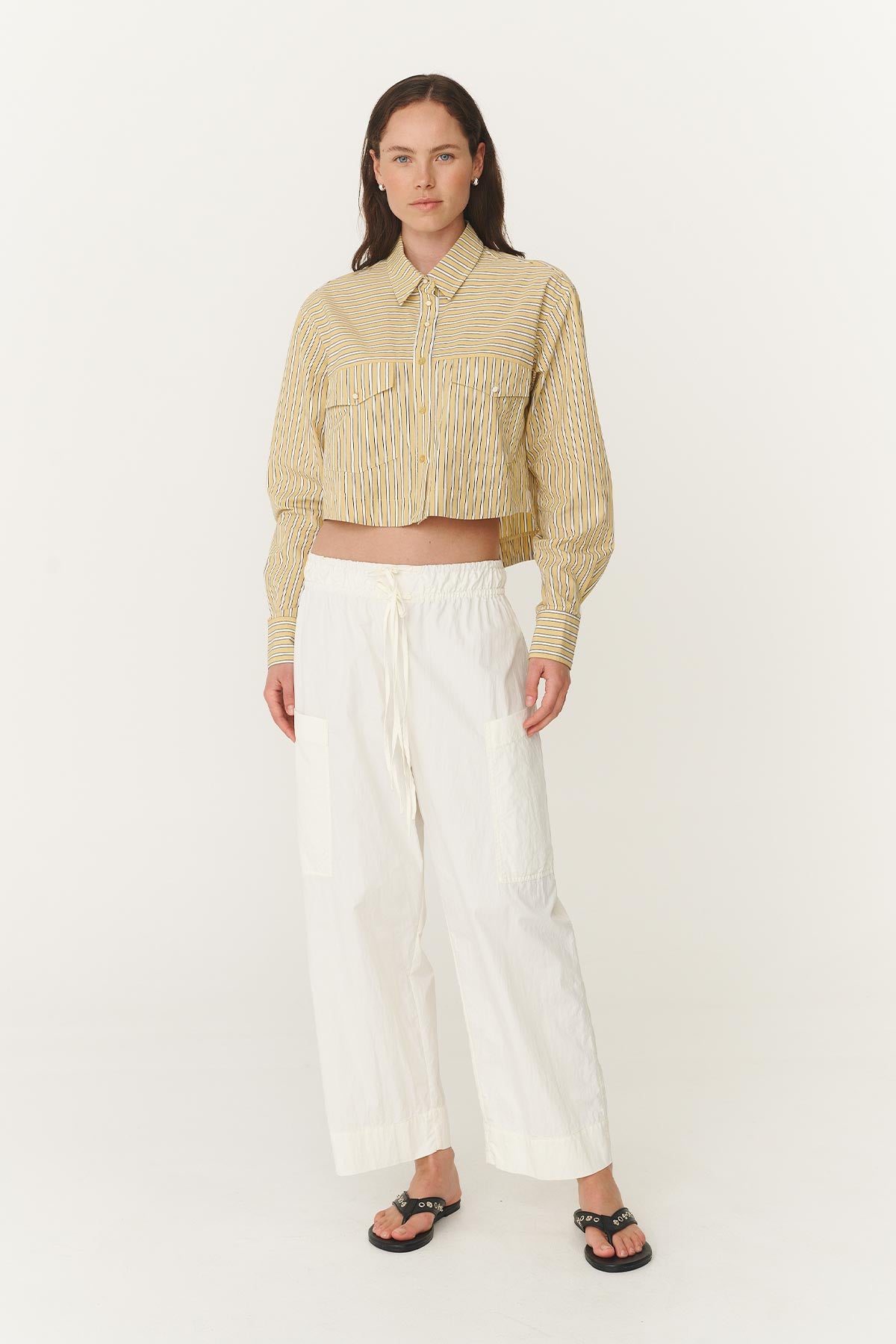 Jessica Cargo Pants in Bone White paired with the Cole Stripe Crop Shirt with button up front pockets and a yellow and white stripe pattern
