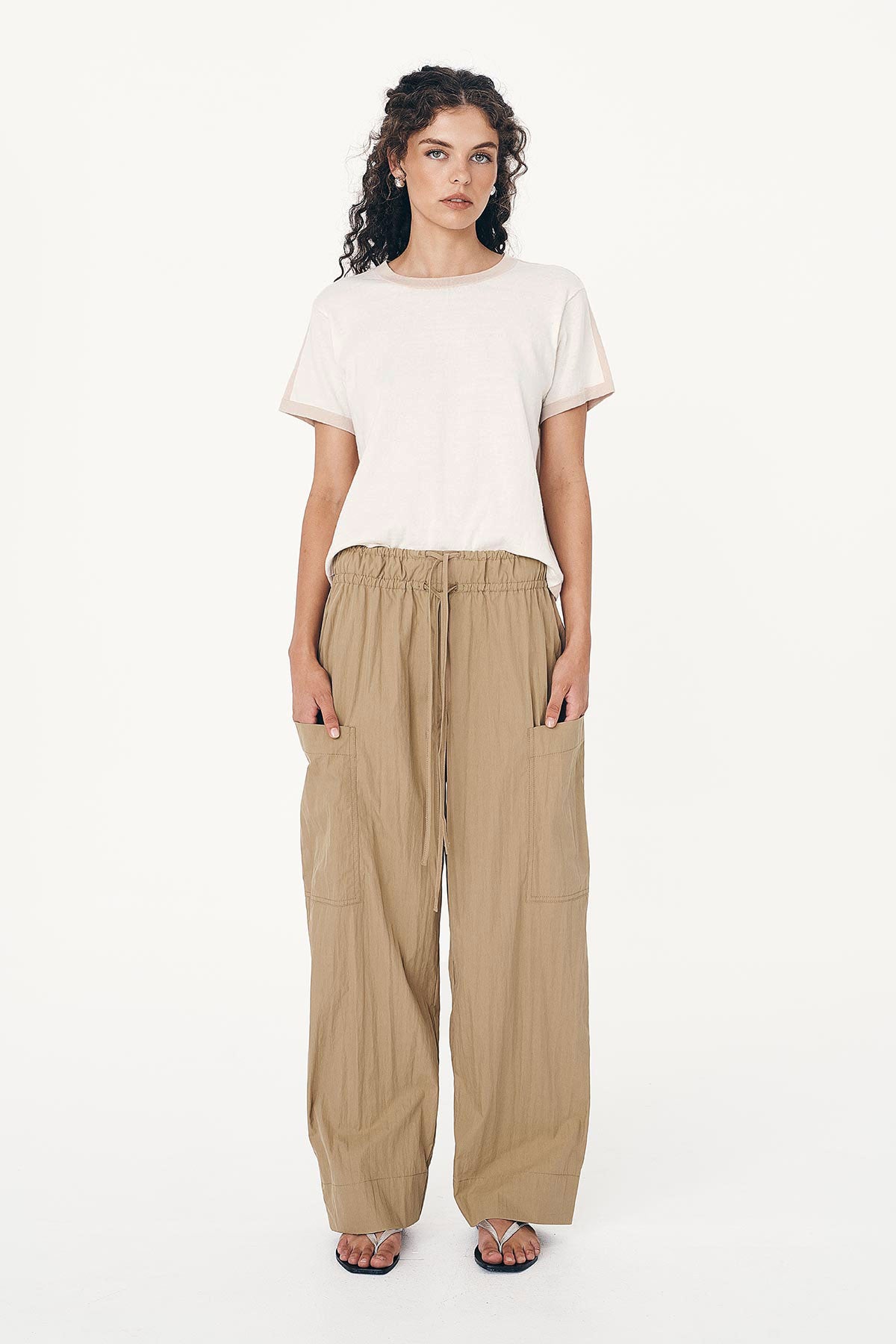 Model wearing Jessica Cargo Pants in Washed Khaki, paired with the Rania Contrast Knit Tee in Oat Milk by ROWIE the Label, front studio view.