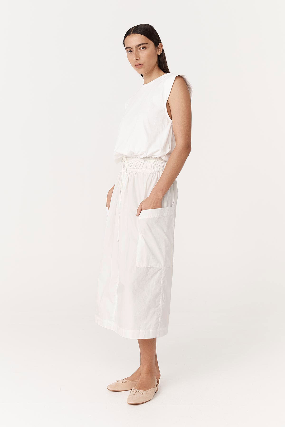 Angled studio view of model wearing a Jessica Organic Midi Dress in Tonal Bone by ROWIE the Label.