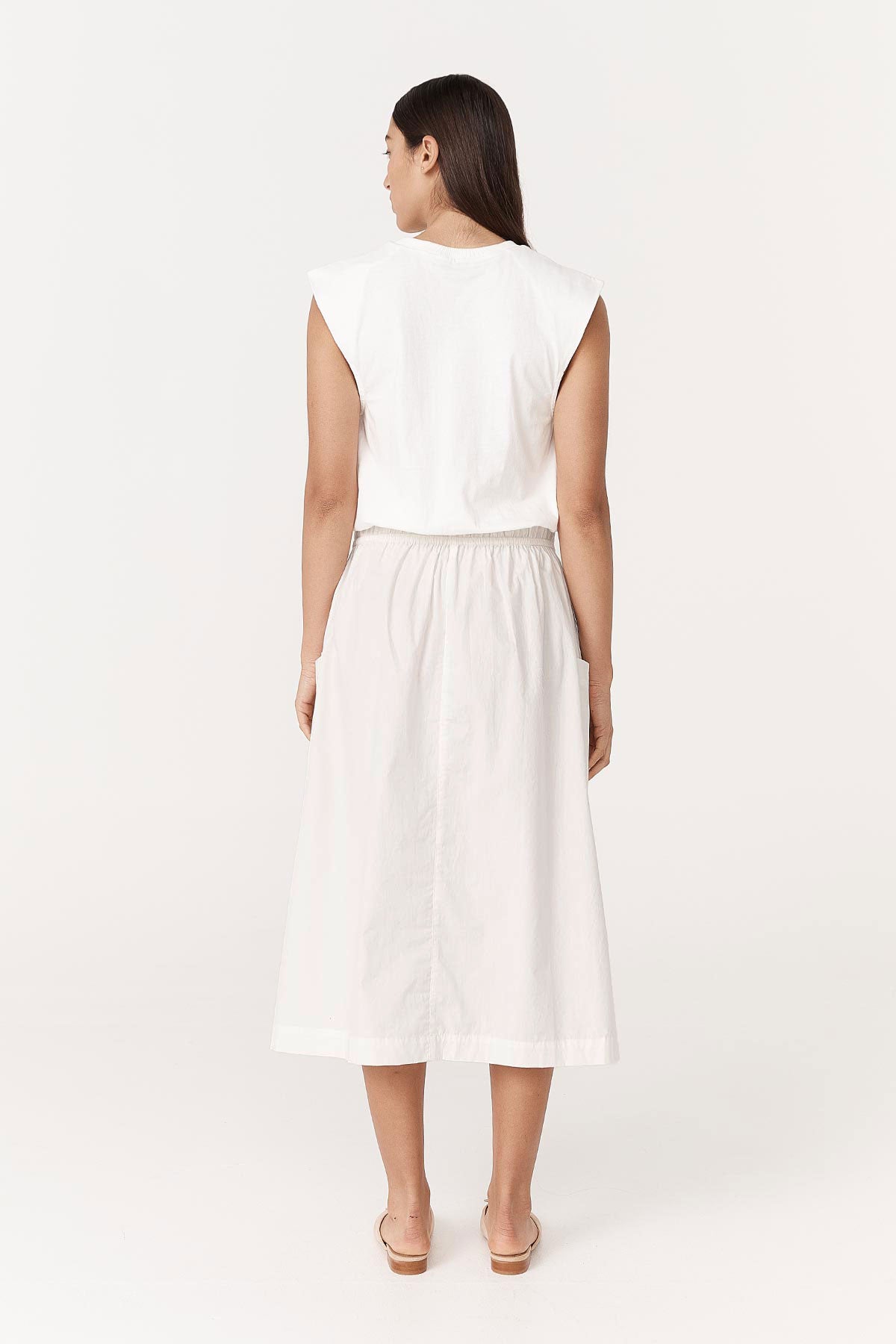 Back studio view of model wearing a Jessica Organic Midi Dress in Tonal Bone by ROWIE the Label.