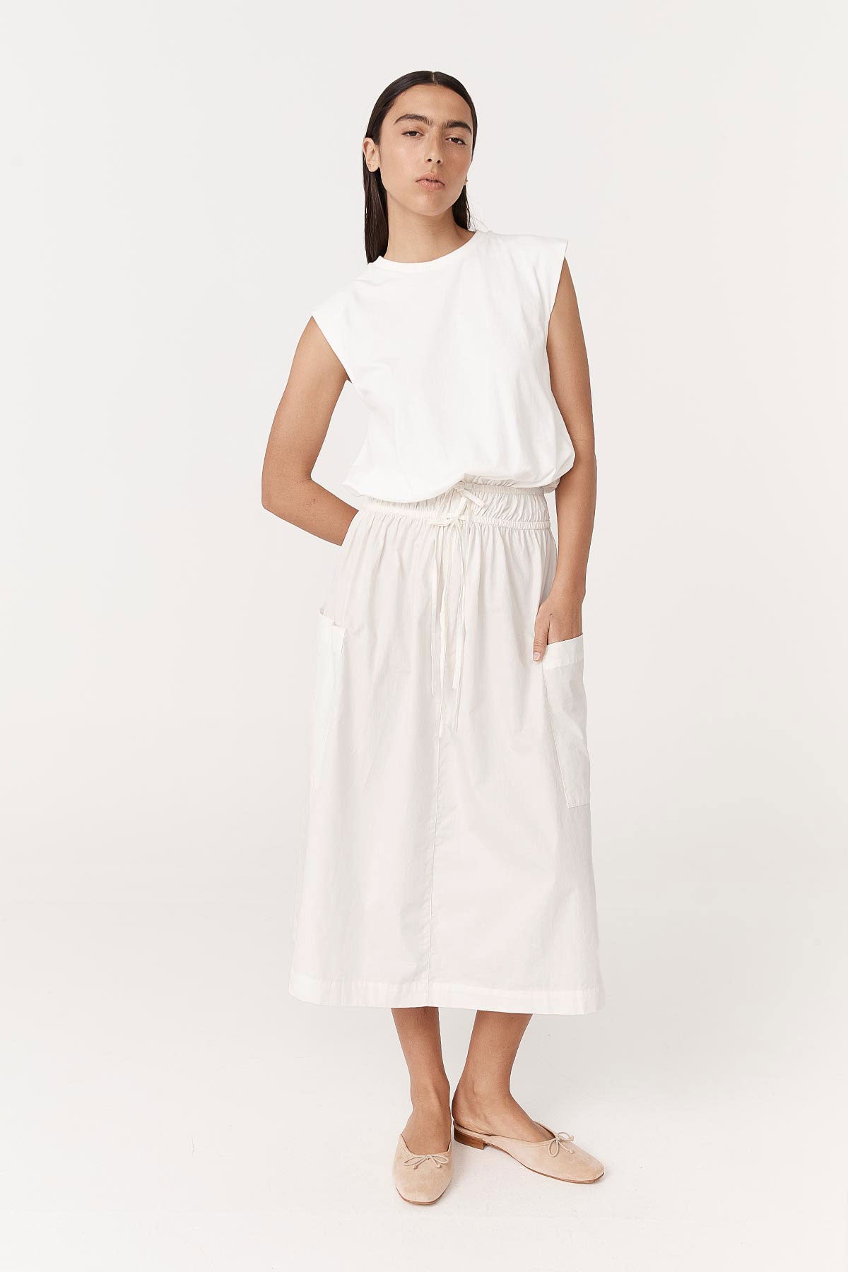 Model wearing a Jessica Organic Midi Dress in Tonal Bone by ROWIE the Label, front studio view