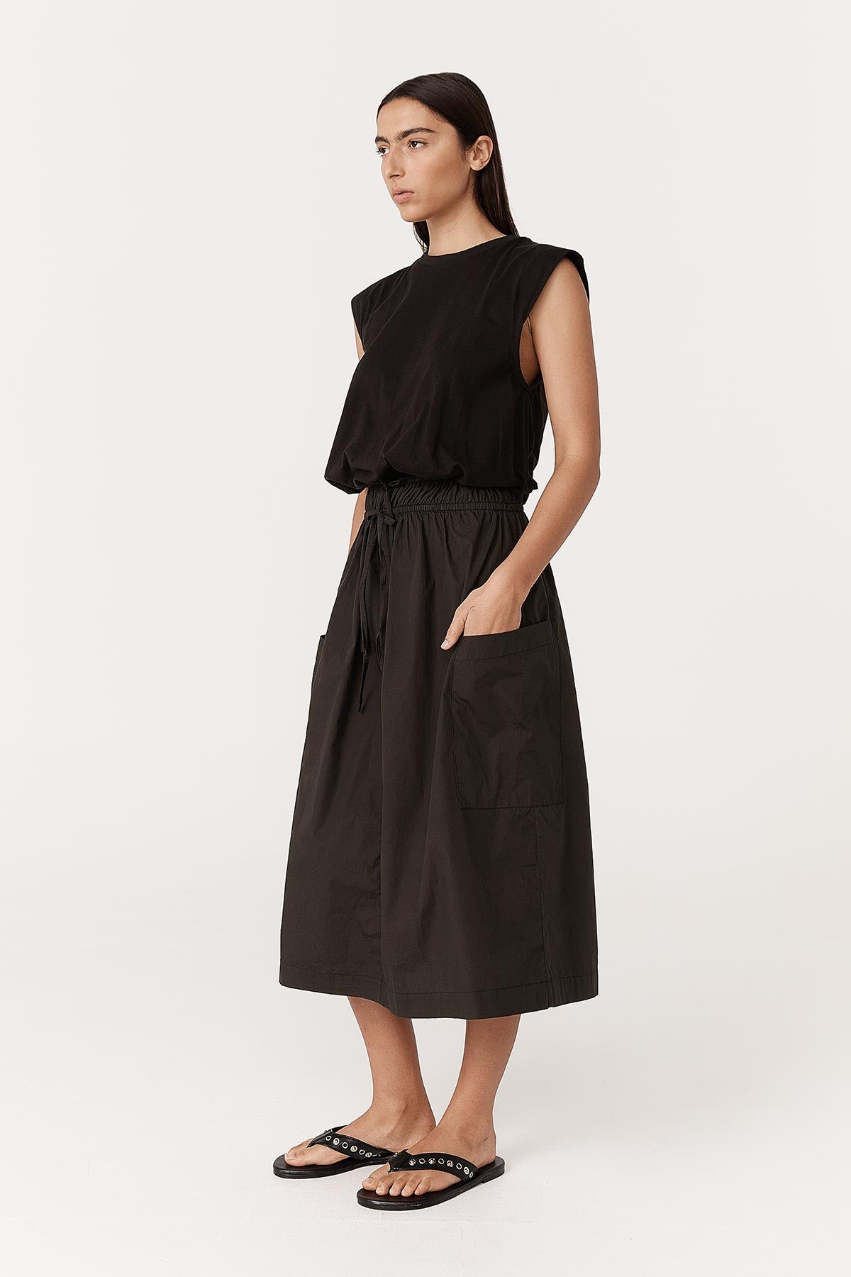 Angled studio view of model wearing a Jessica Organic Midi Dress in Tonal Noir by ROWIE the Label.