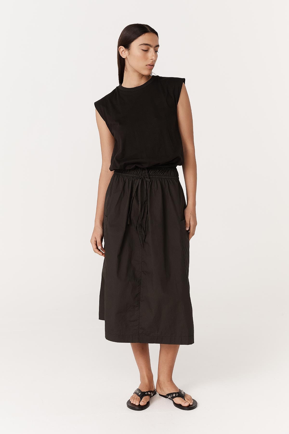 Model wearing a Jessica Organic Midi Dress in Tonal Noir by ROWIE the Label, front studio view.