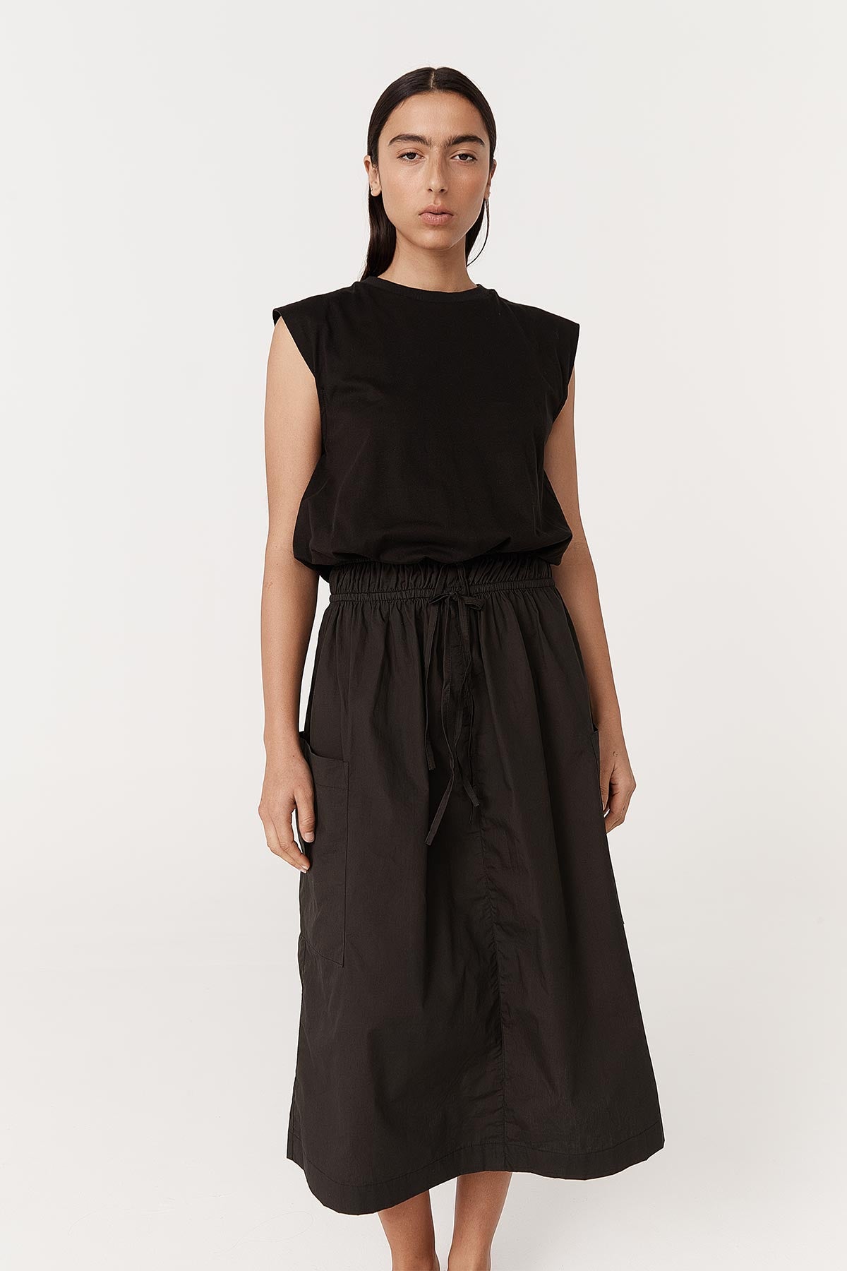 Full-body studio view of model wearing a Jessica Organic Midi Dress in Tonal Noir by ROWIE the Label.