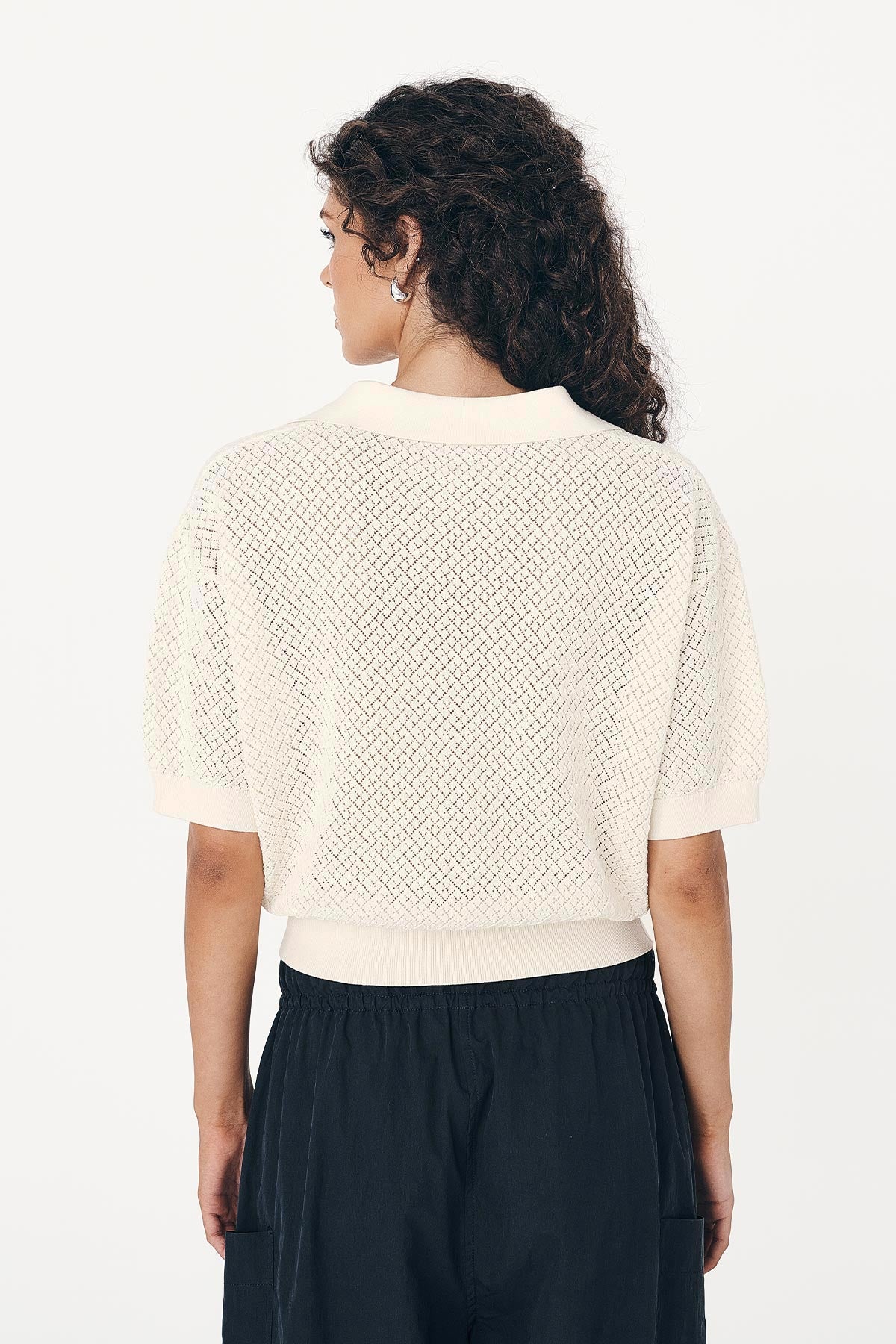 Loretta Pointelle Knit Top back shot, highlighting cropped cut waist and textured knit design