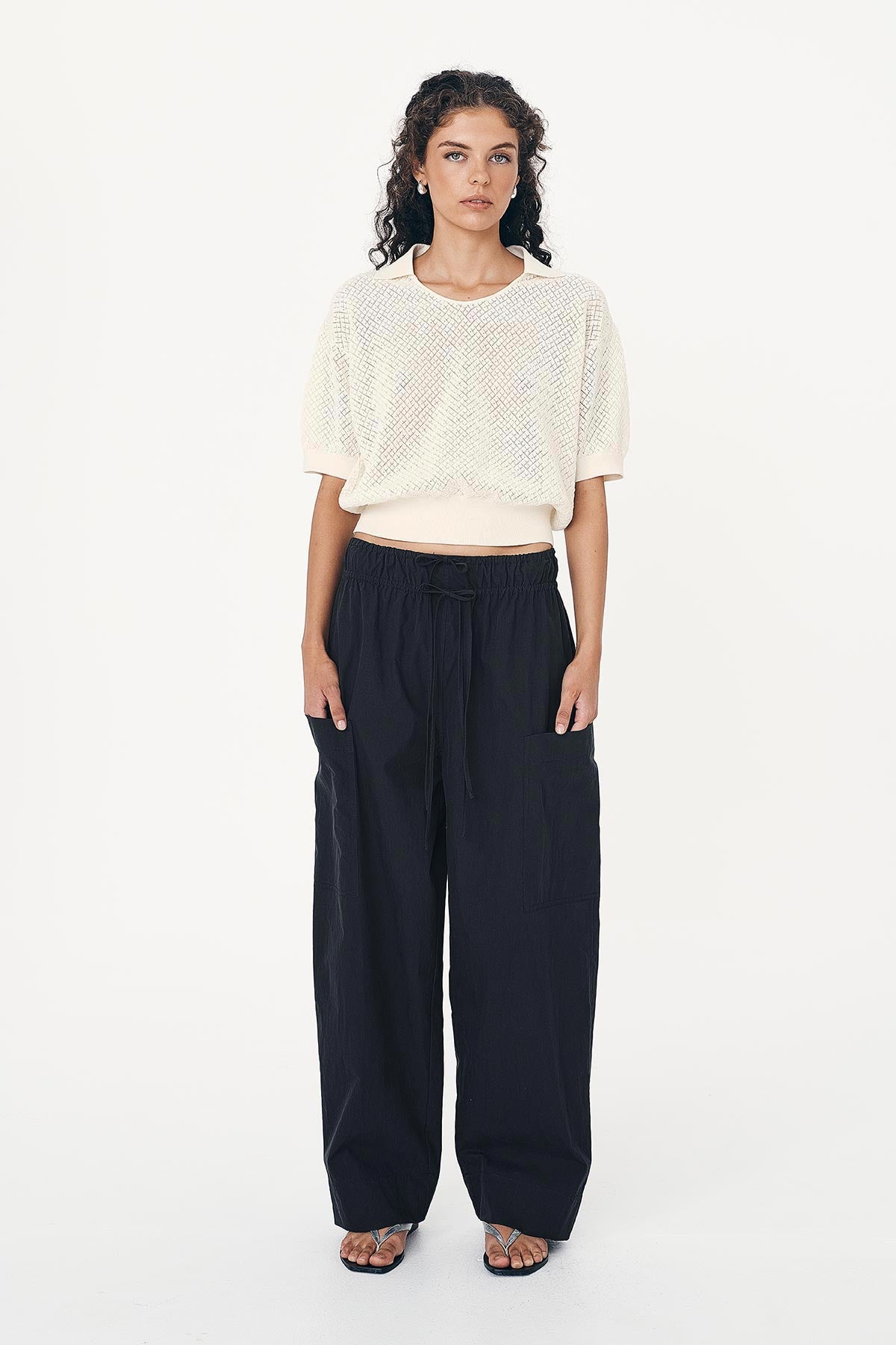 Loretta Pointelle Knit Top in white paired with the full length, double tie Jessica Cargo Pants in a washed ink black