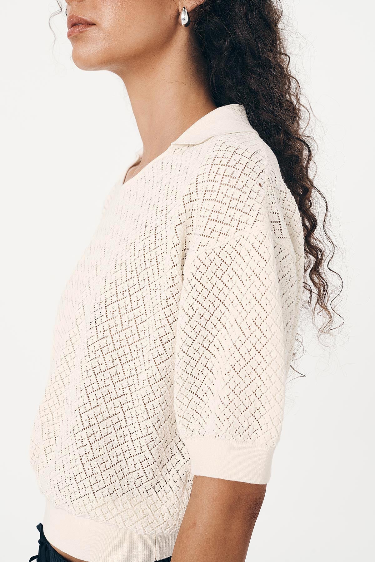 Close-up of Loretta Pointelle Knit Top showing textured detailing and polo-style collar 