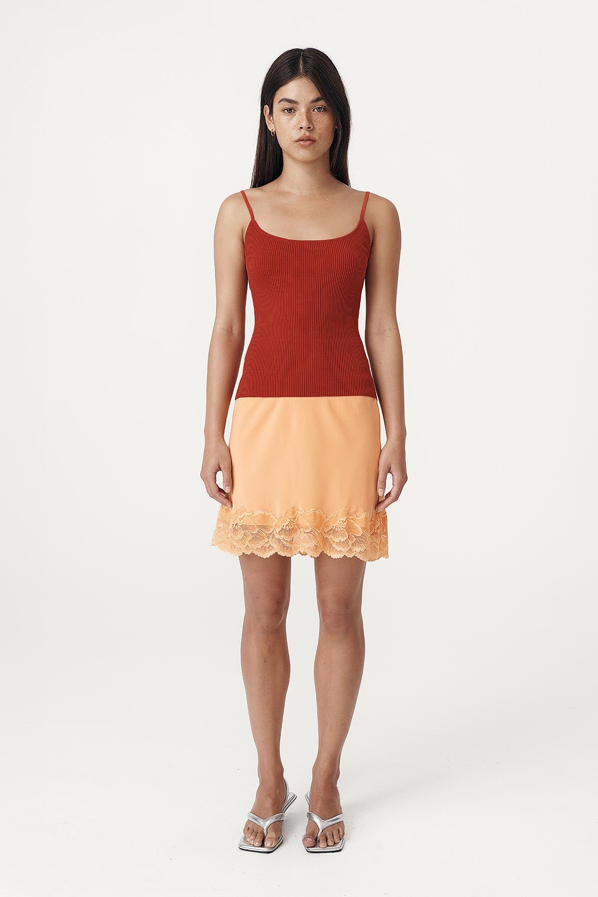 Marina Silk Mini Skirt with a lace trim hem paired with the Ruby Rib Knit Singlet in Paprika Red