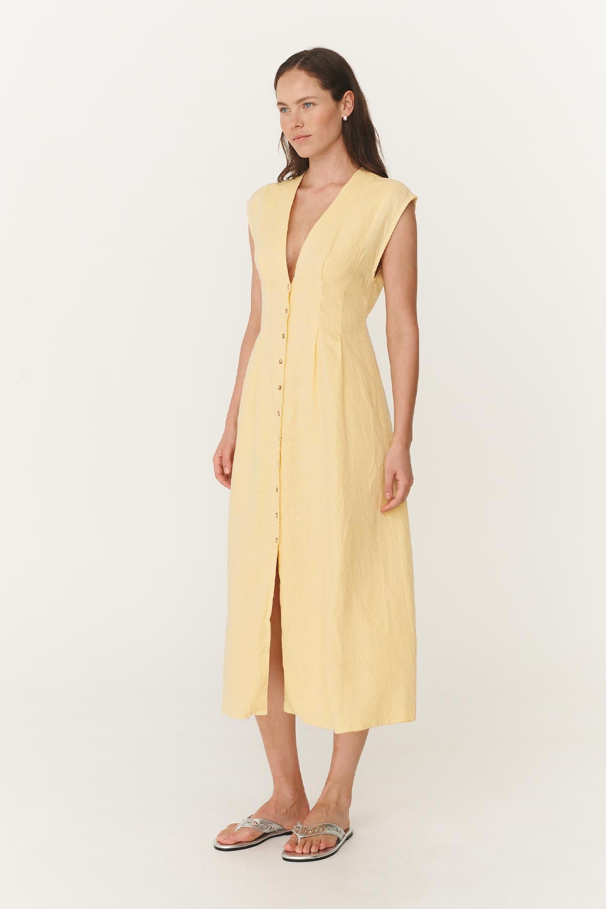Model wears a Mira Linen Midi Dress in Lemon Yellow 