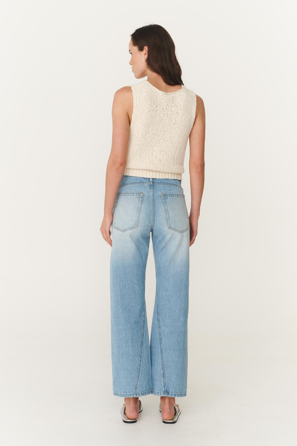 Back studio view of model wearing Percy Curve Seam Jeans in Faded Blue, styled with the Catalina Knit Tank in Creme by ROWIE the Label.