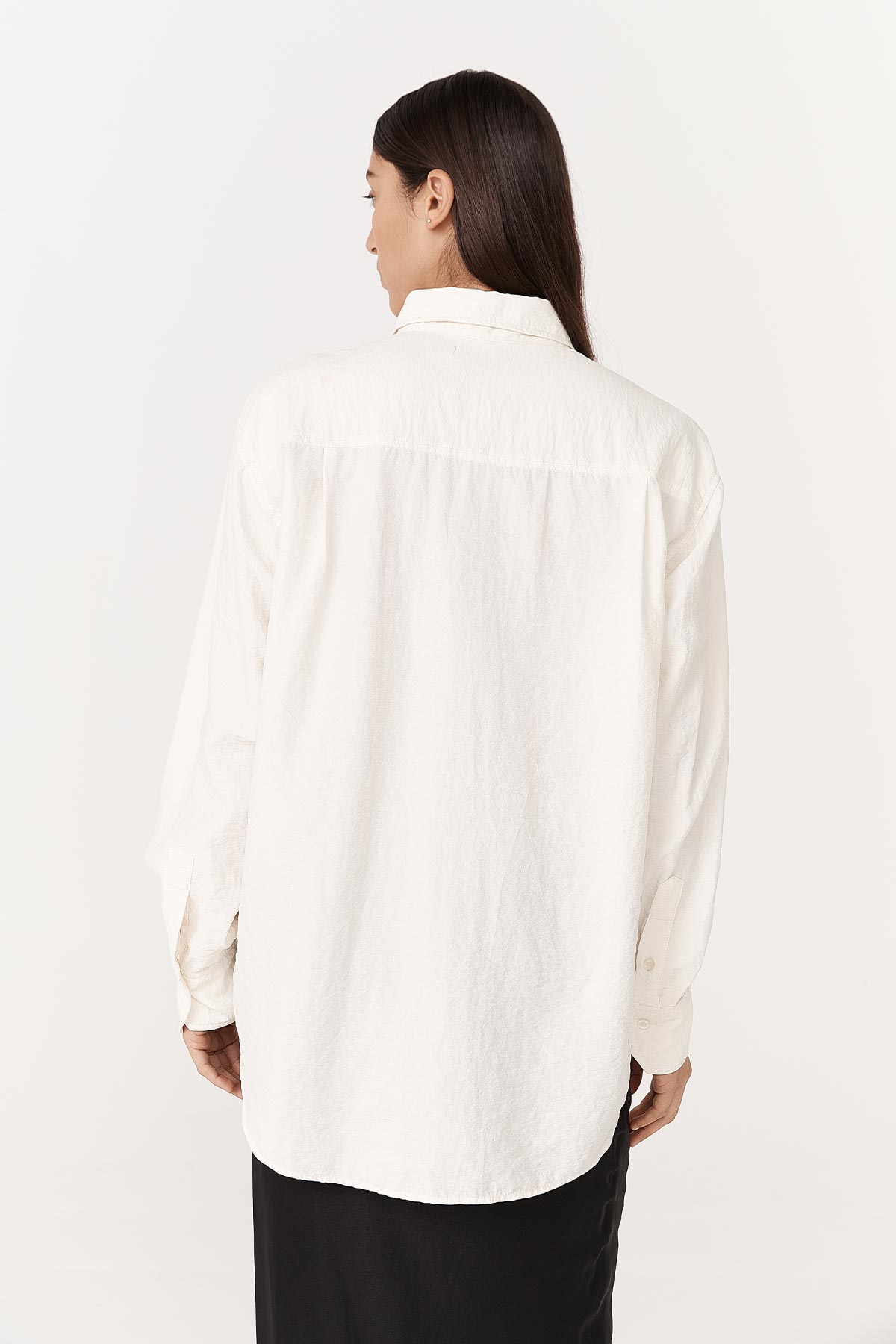 Ramona long-sleeve, silk shirt, paired with the Marina Silk Midi Skirt in black on a white background