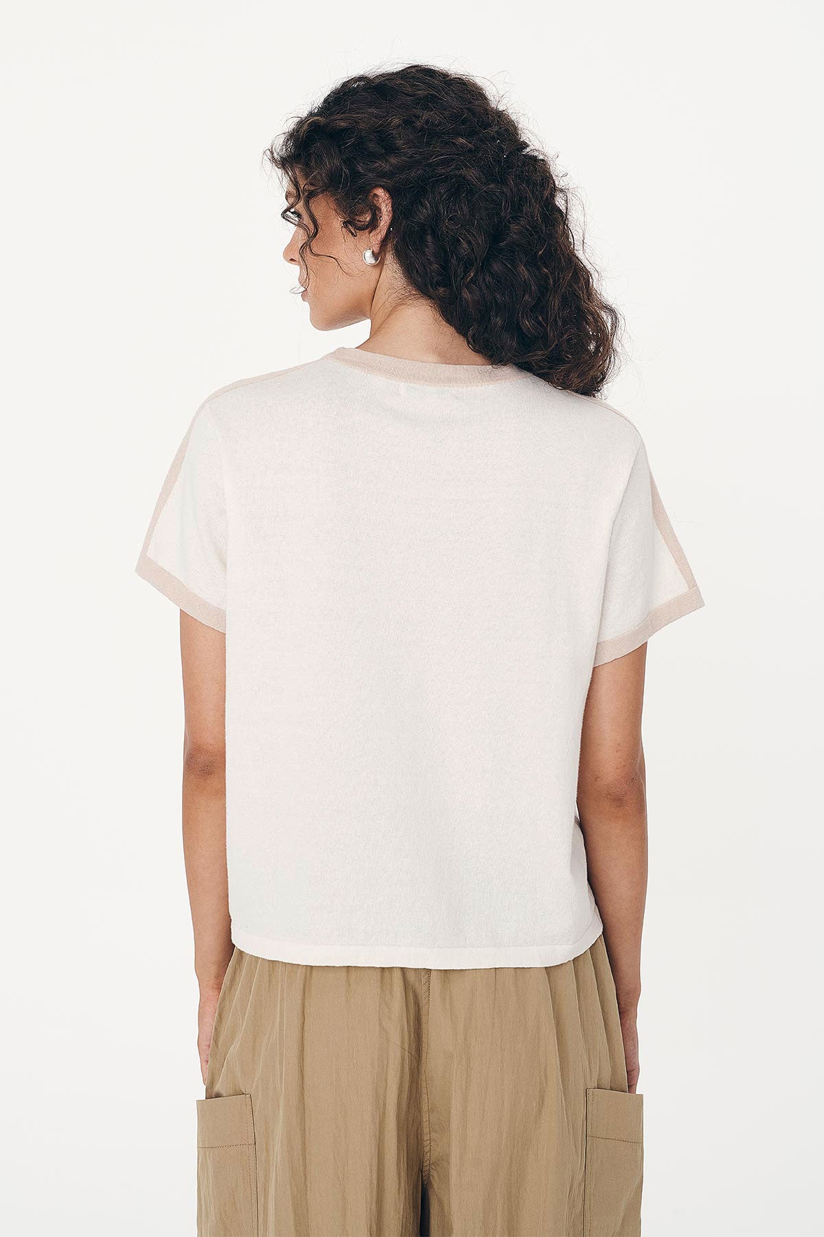 Back studio view of model wearing a Rania Contrast Knit Tee in Oat Milk, styled with the Jessica Cargo Pants in Washed Khaki by ROWIE the Label.
