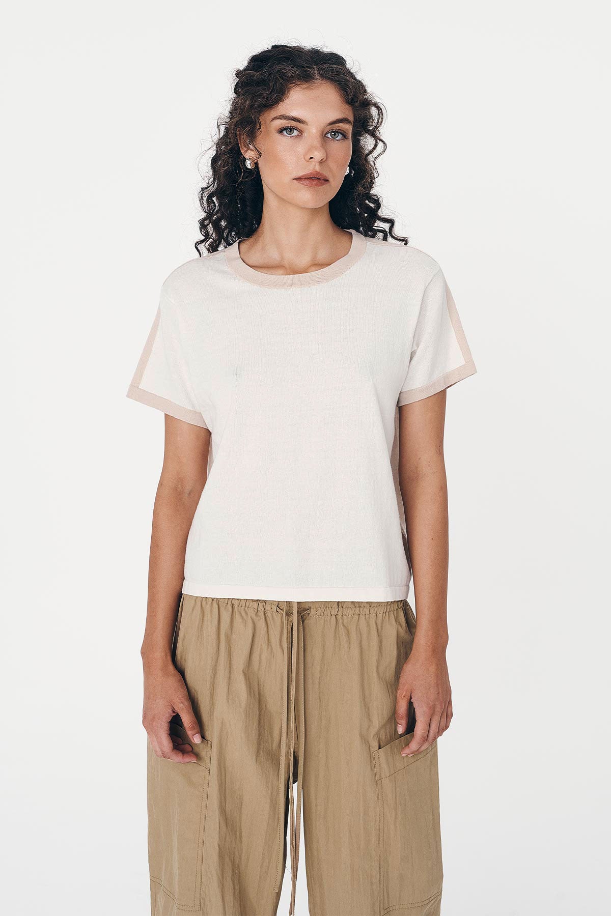 Model wearing a Rania Contrast Knit Tee in Oat Milk, styled with the Jessica Cargo Pants in Washed Khaki by ROWIE the Label, front studio view.