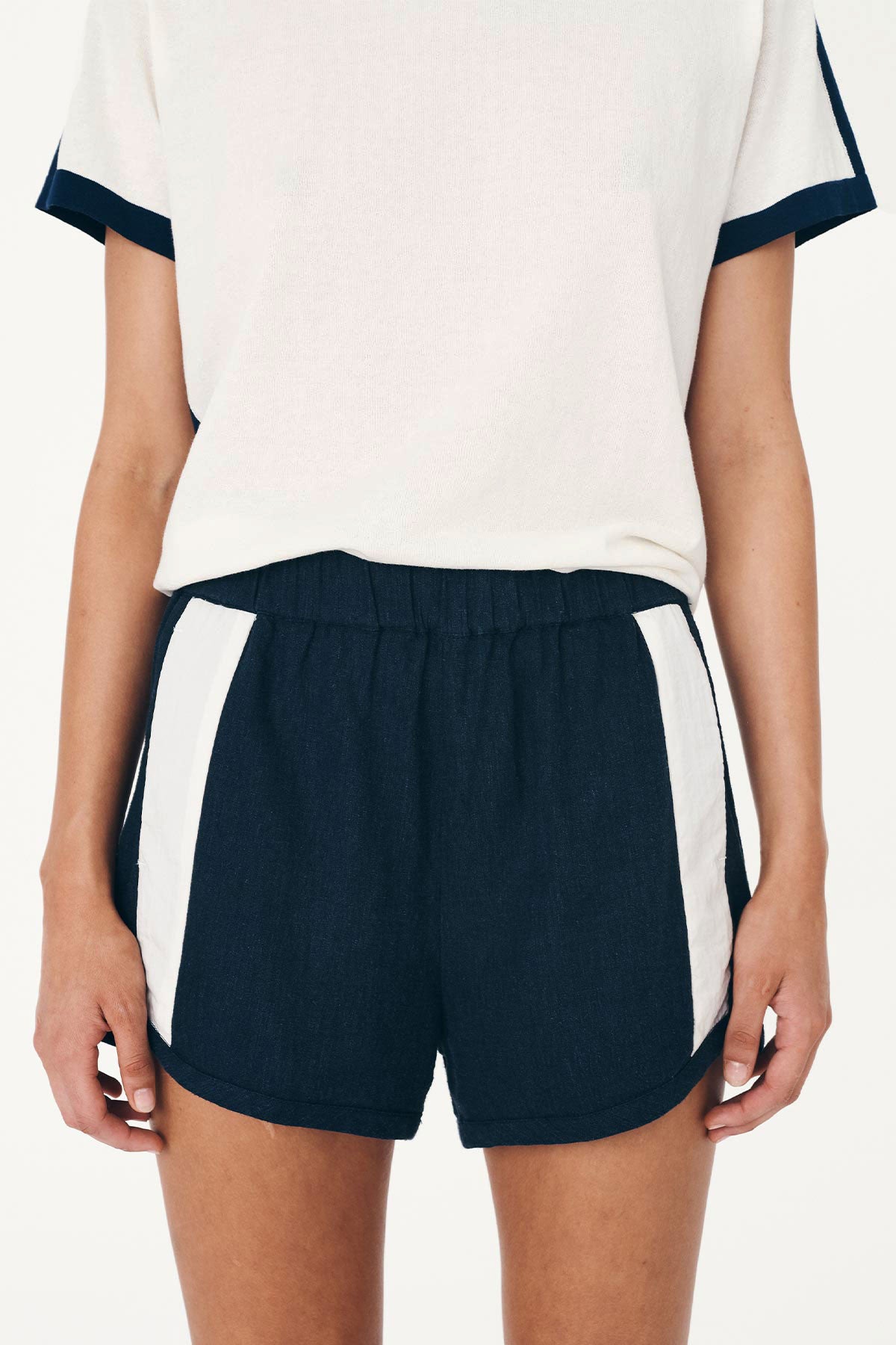 Close-up studio view of Simone Linen Shorts in Ink, styled with the Rania Contrast Knit Tee in Ink by ROWIE the Label.